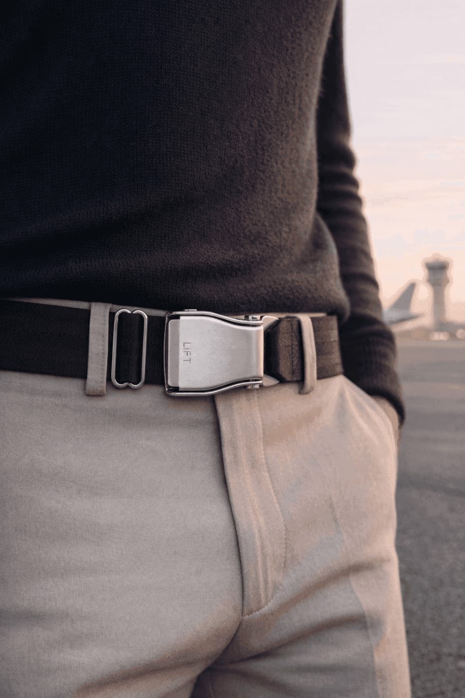 Fly-Belts POLAR · airplane buckle belt worn with navy sweater and khaki chinos on the tarmac at sunset